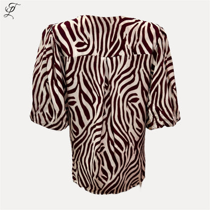 Chastar Viscose Blouse Zebra Print met losse fit, elastische pofmouwen en opvallende zebraprint voor een casual look.