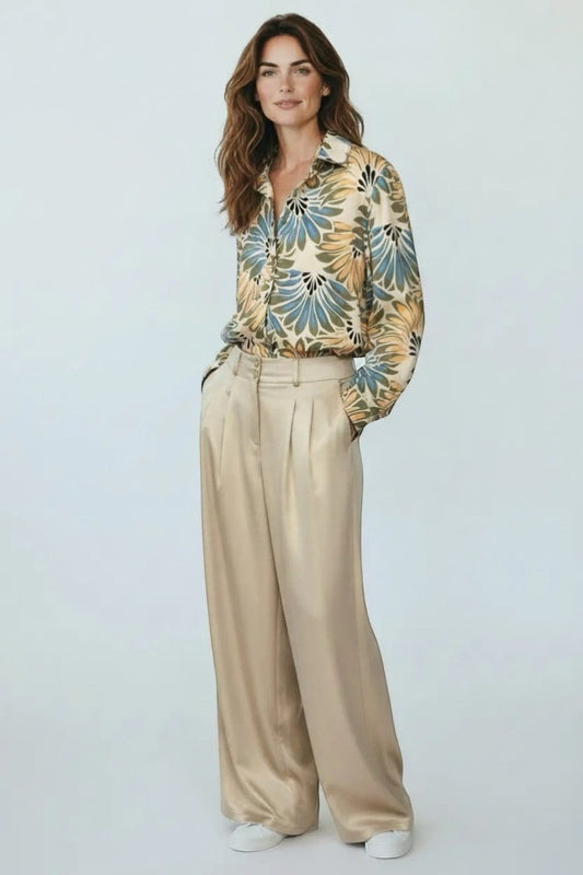 Trendy Leslie champagne satin wide-leg pleated high-waisted trousers with a relaxed fit.