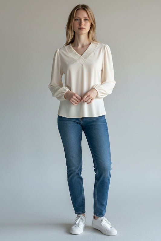 Trendy Leslie Chastar cream V-neck long sleeve top with pleated neckline and soft stretch fabric.
