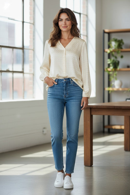 Trendy Leslie off white V-neck blouse with subtle square pattern, button-down front, and elastic cuffs.