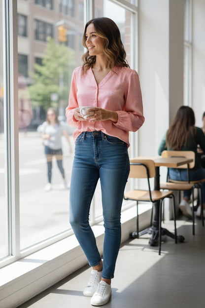 Trendy Leslie Chastar V-neck blouse in salmon pink with a subtle square pattern, long sleeves, and button-down front.