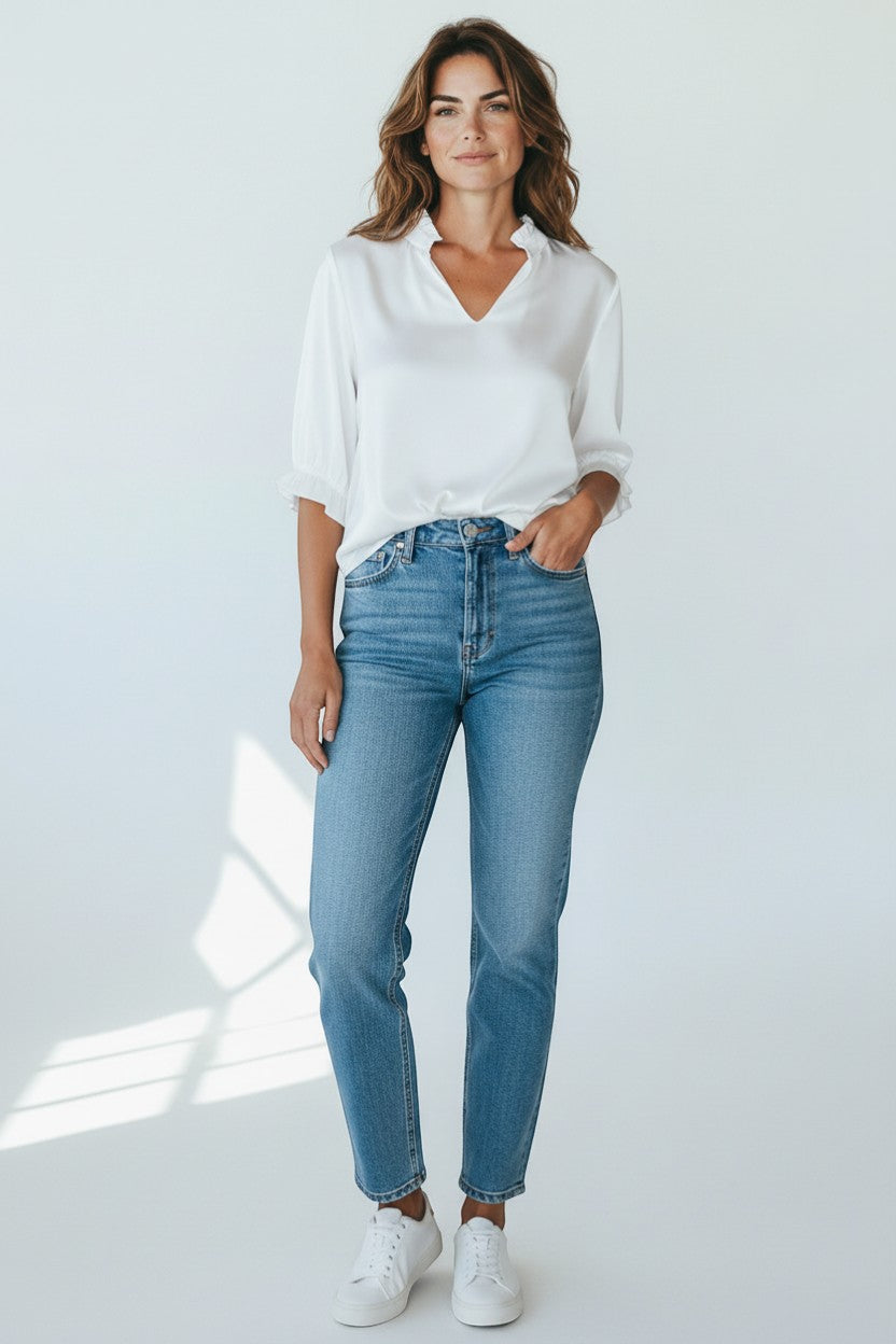 Trendy Leslie white silk-viscose V-neck top with ruffled neckline and cuffs.