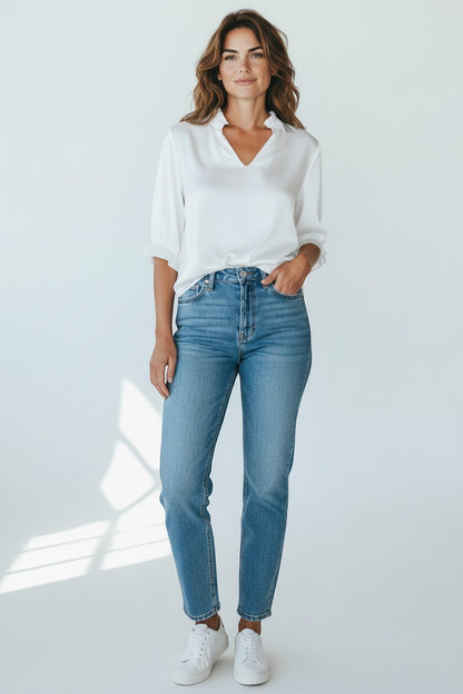 Trendy Leslie white silk-viscose V-neck top with ruffled neckline and cuffs.